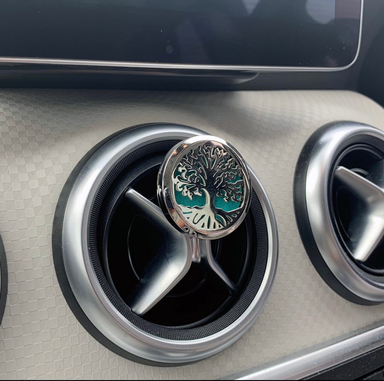 Tree of life aromatherapy car diffuser. With absorbent pad to drop on essential oils and inhale in the car.