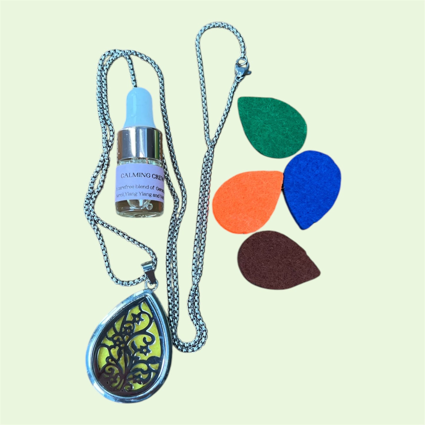 Pendant aromatherapy diffuser necklace with spare felt pads and 2 ml Hayling Aromatherapy calming blend.