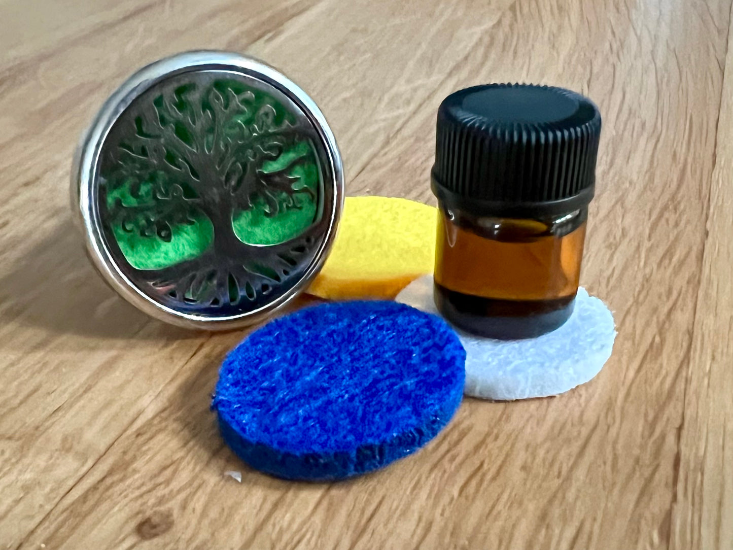 Tree of life aromatherapy car diffuser. With absorbent pad to drop on essential oils and inhale in the car.
