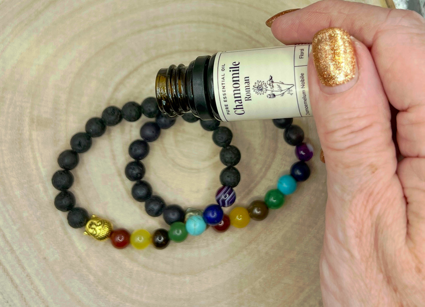 Personal / Lava bead aromatherapy bracelet. Absorbent volcanic rock beads with Buddha charm and chakra colour theme beads.