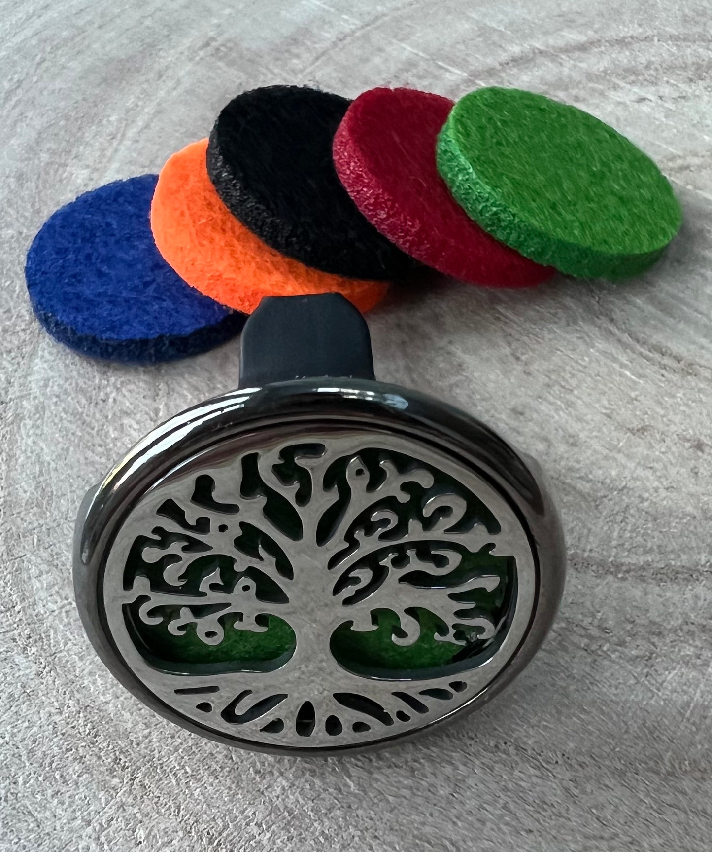 Tree of life aromatherapy car diffuser. With absorbent pad to drop on essential oils and inhale in the car.