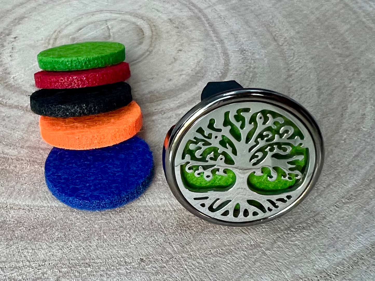 Tree of life aromatherapy car diffuser. With absorbent pad to drop on essential oils and inhale in the car.
