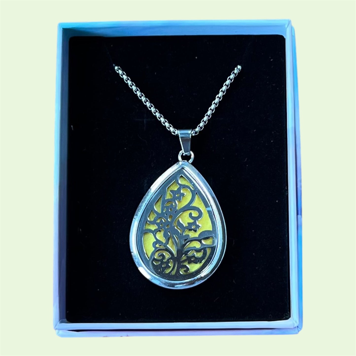 Pendant aromatherapy diffuser necklace with spare felt pads and 2 ml Hayling Aromatherapy calming blend.