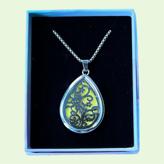 Pendant aromatherapy diffuser necklace with spare felt pads and 2 ml Hayling Aromatherapy calming blend.