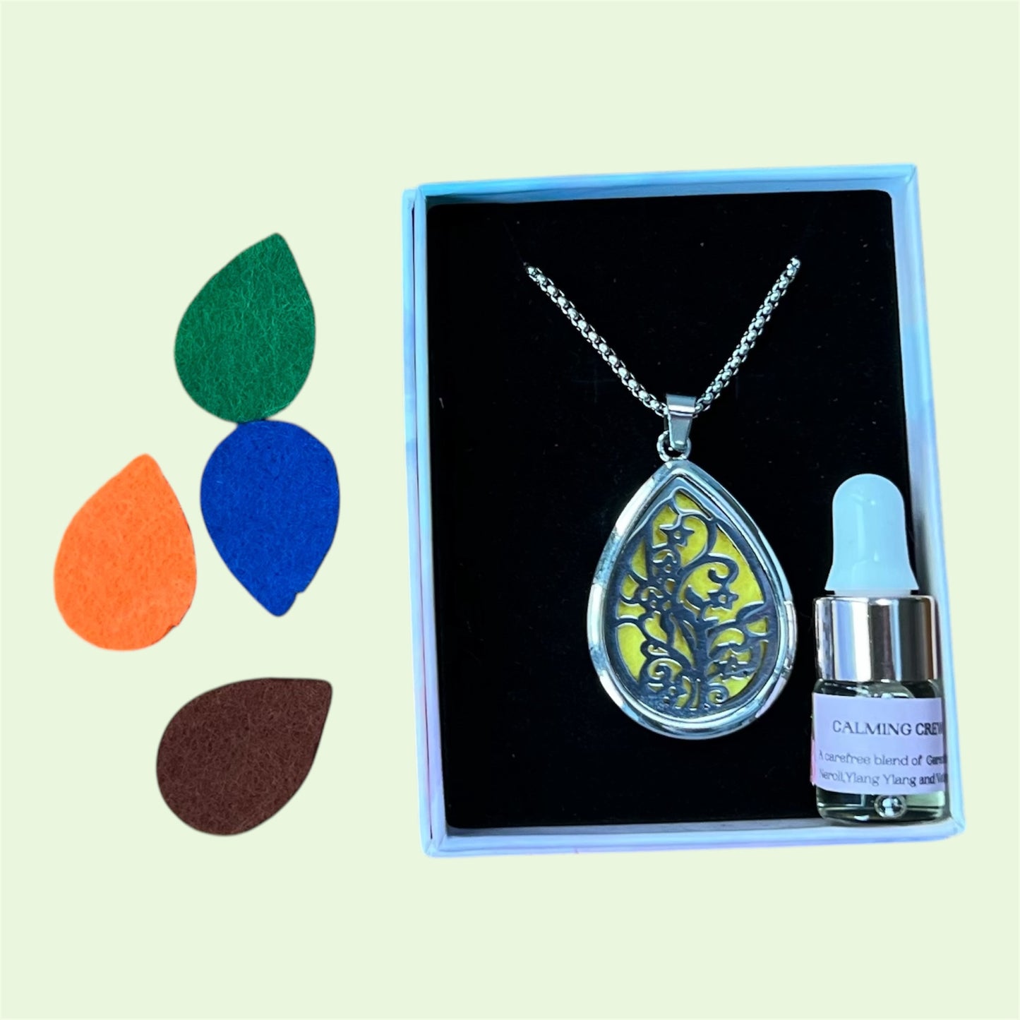 Pendant aromatherapy diffuser necklace with spare felt pads and 2 ml Hayling Aromatherapy calming blend.